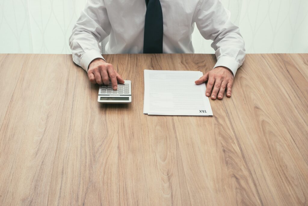 Businessman checking tax forms